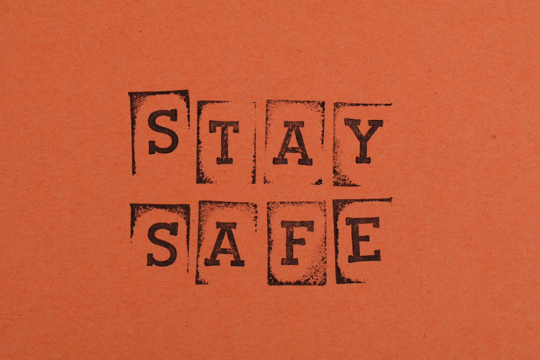a stay safe text on an orange background